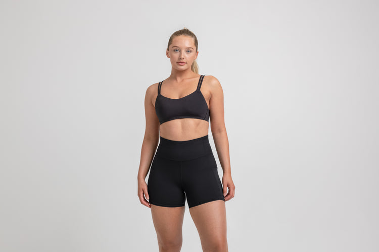 Athlete wearing the Black REP Women’s Forma Shorts.