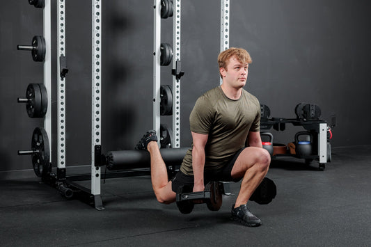 Athlete works on the Altitude™ power rack.