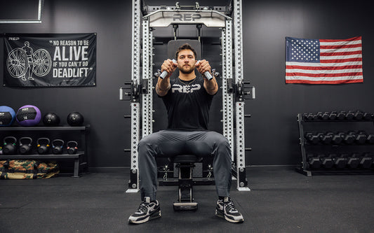 Man working out on a REP Ares cable attachment