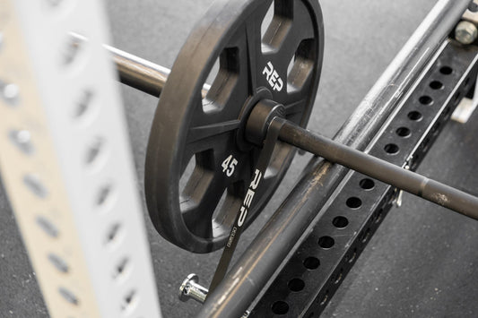 Bands attached to a power rack and barbell.