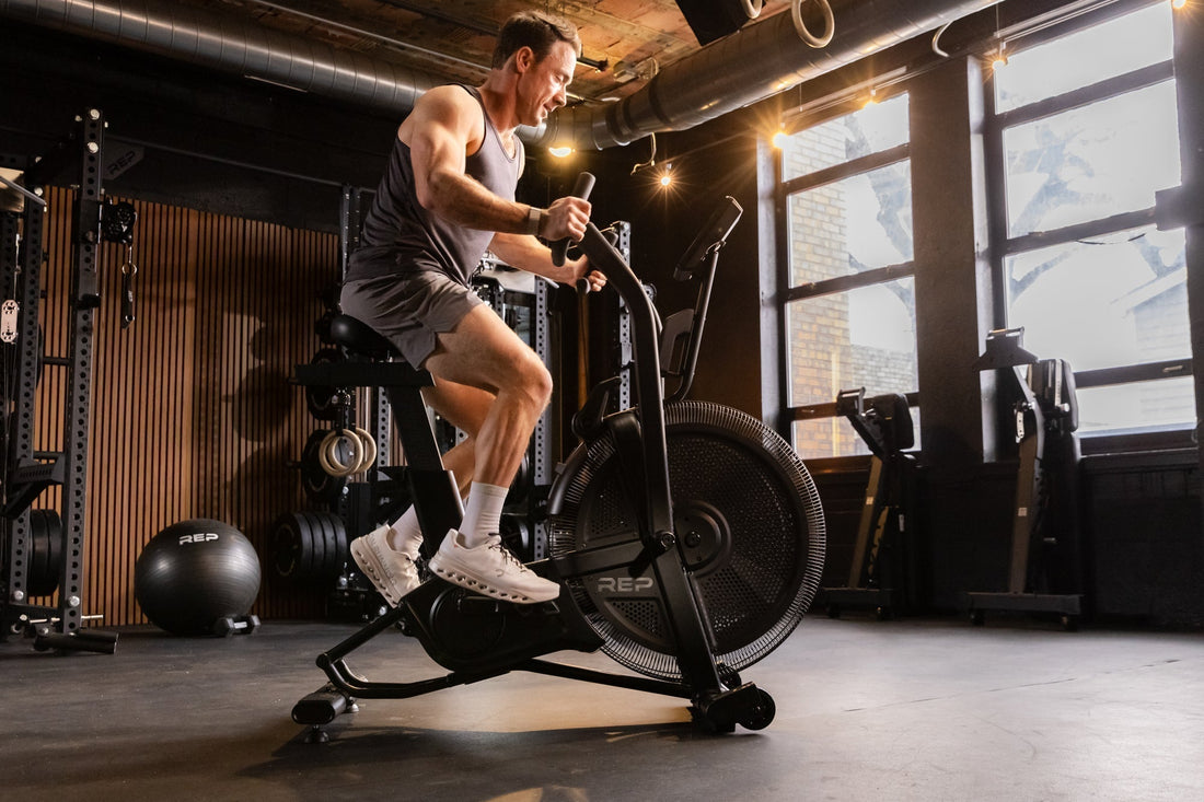Athlete tackles low-impact cardio on the Strive™ Air Bike.