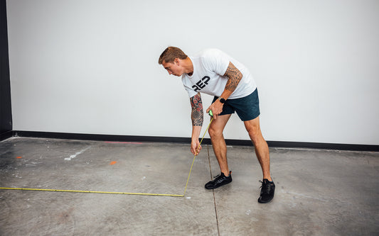 Man measuring the floor