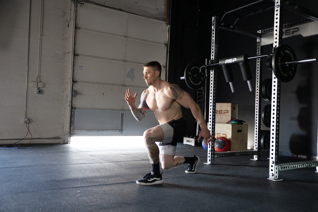 An athlete tackles lunges in their garage gym.