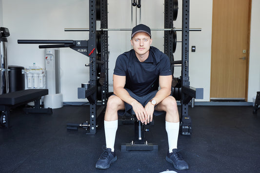 Man sitting on a weight bench