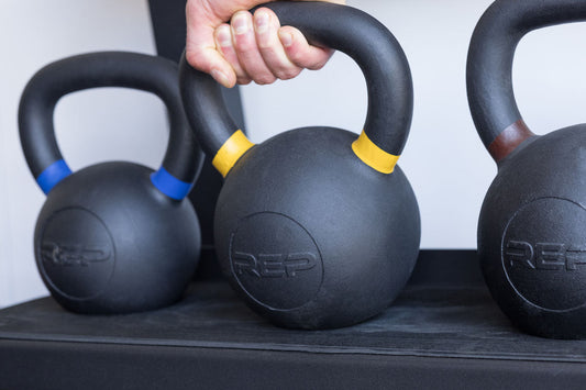 Hand grabs a REP® Kettlebell.
