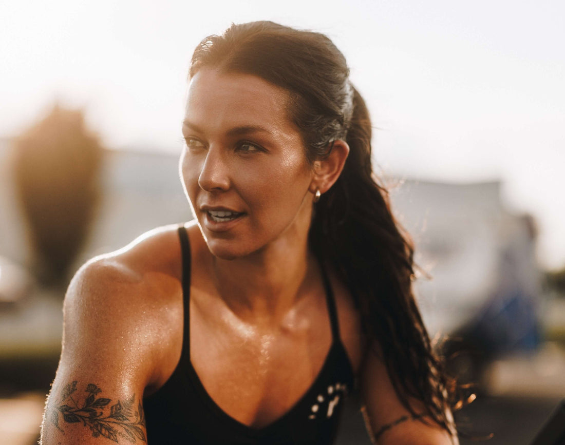 Lexi Johnson has the sun behind her, standing outside after a workout.