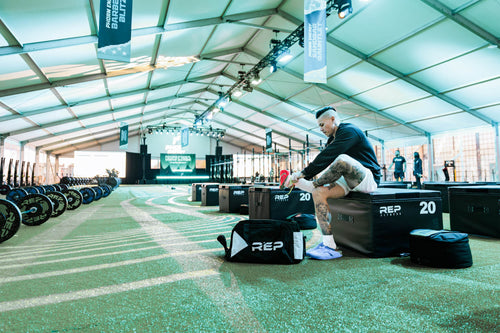 Athlete unloads their REP® Gym Bag.
