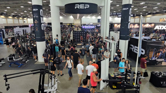 Overhead view of people and equipment at the REP Fitness booth at HomeGymCon 2026