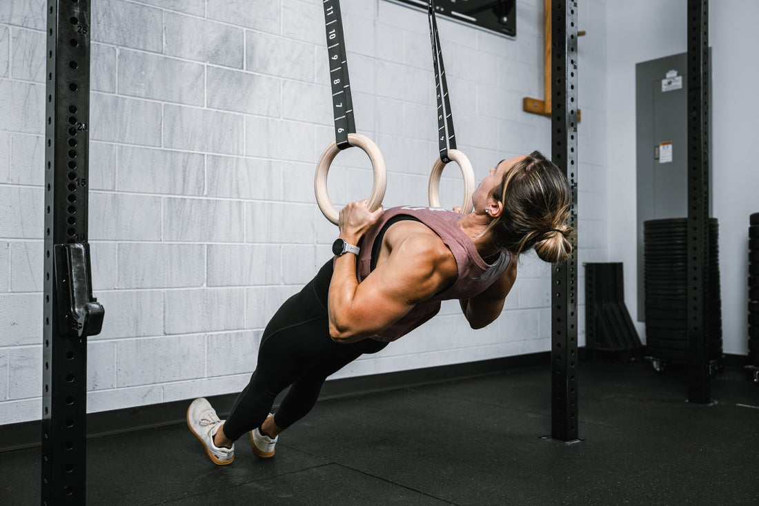 Athlete does back work on REP gymnastic rings.