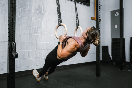 Athlete does back work on REP gymnastic rings.