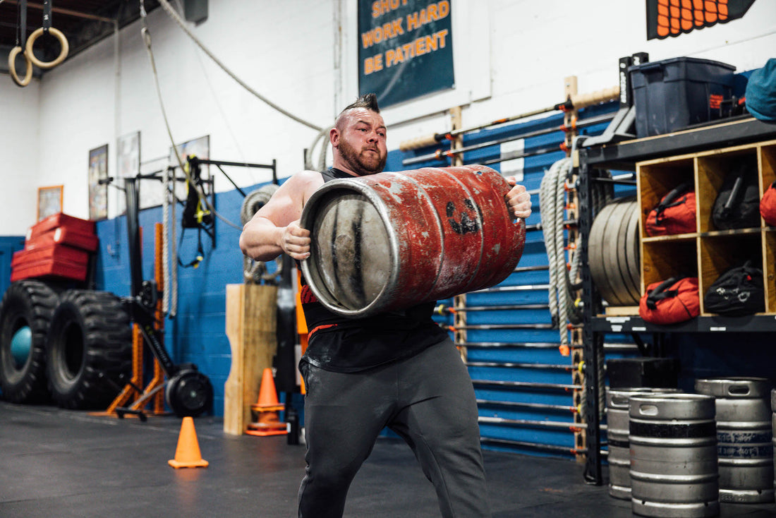 Rob Kearney, strongman, doing keg work