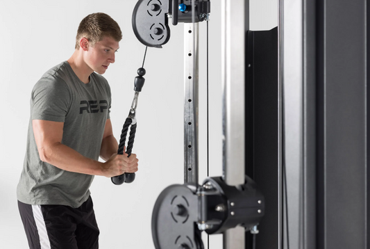 Man doing tricep pressdowns with a rope