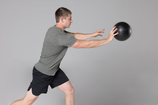 Athlete throws a REP® Slam Ball.