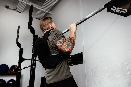 Man in Strata™ Weight Vest does pull-ups.