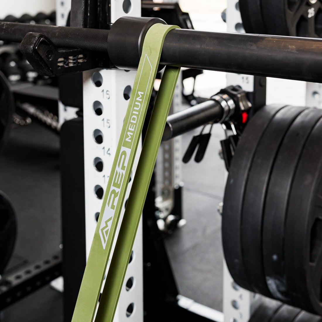 The REP Fitness Resistance Band 2.0 looped on barbell
