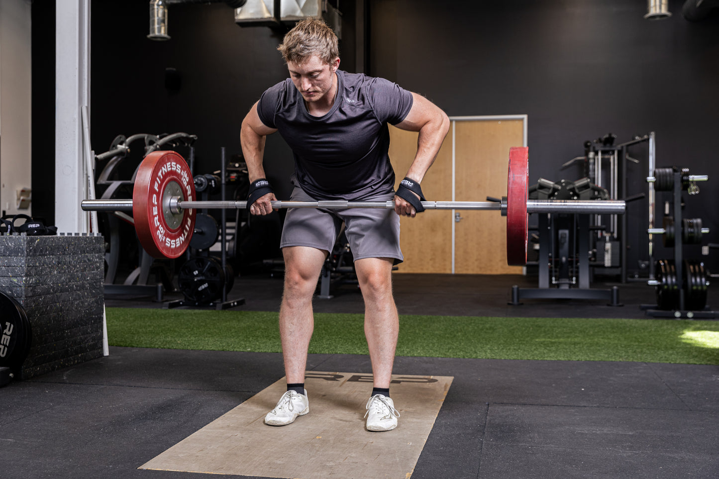 Athlete using the REP Fitness figure 8 lifting straps