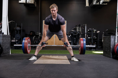 Athlete using the REP Fitness figure 8 lifting straps