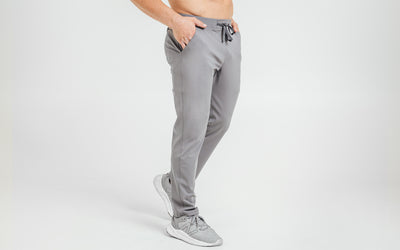 Side view of model wearing the cool gray REP Felix Pants