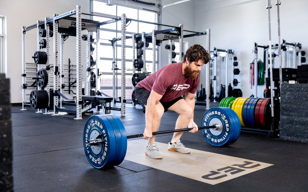 Person getting ready to deadlift using the Colorado Short Bar