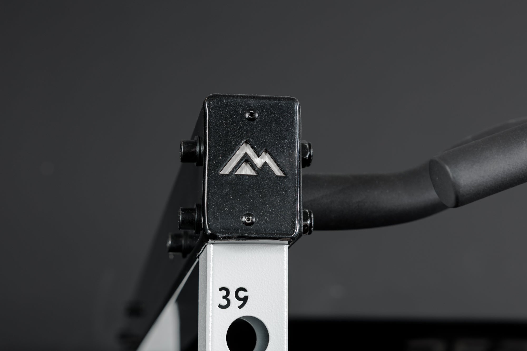 Close-up shot of the branded crossmembers on the REP Fitness Altitude™ Power Rack