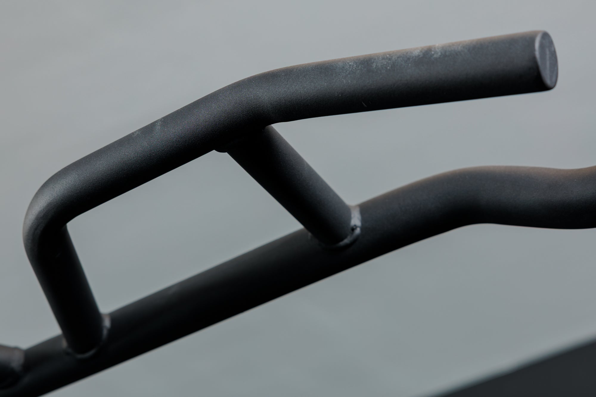 Close-up shot of the Multi-Grip Pull-Up Bar on the REP Fitness Altitude™ Power Rack