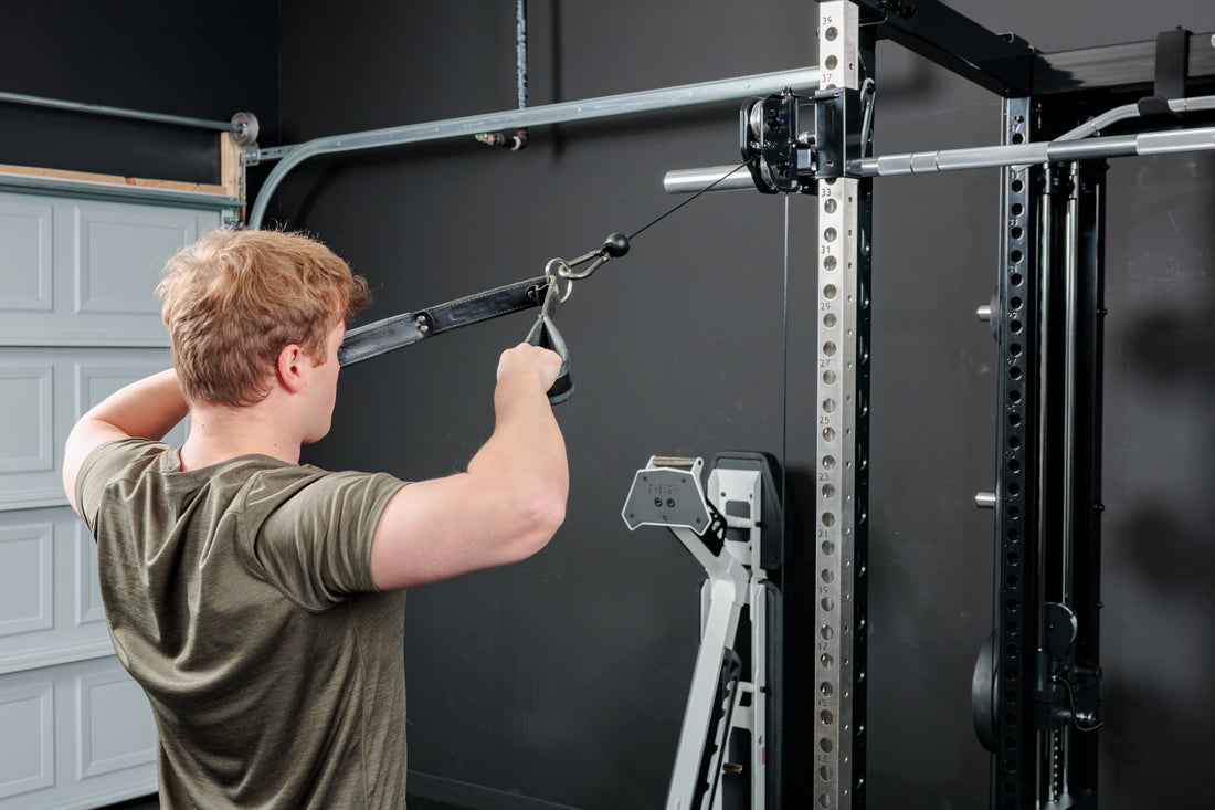 Athlete doing face-pulls on the REP Fitness Altitude™ Power Rack Cable Attachment