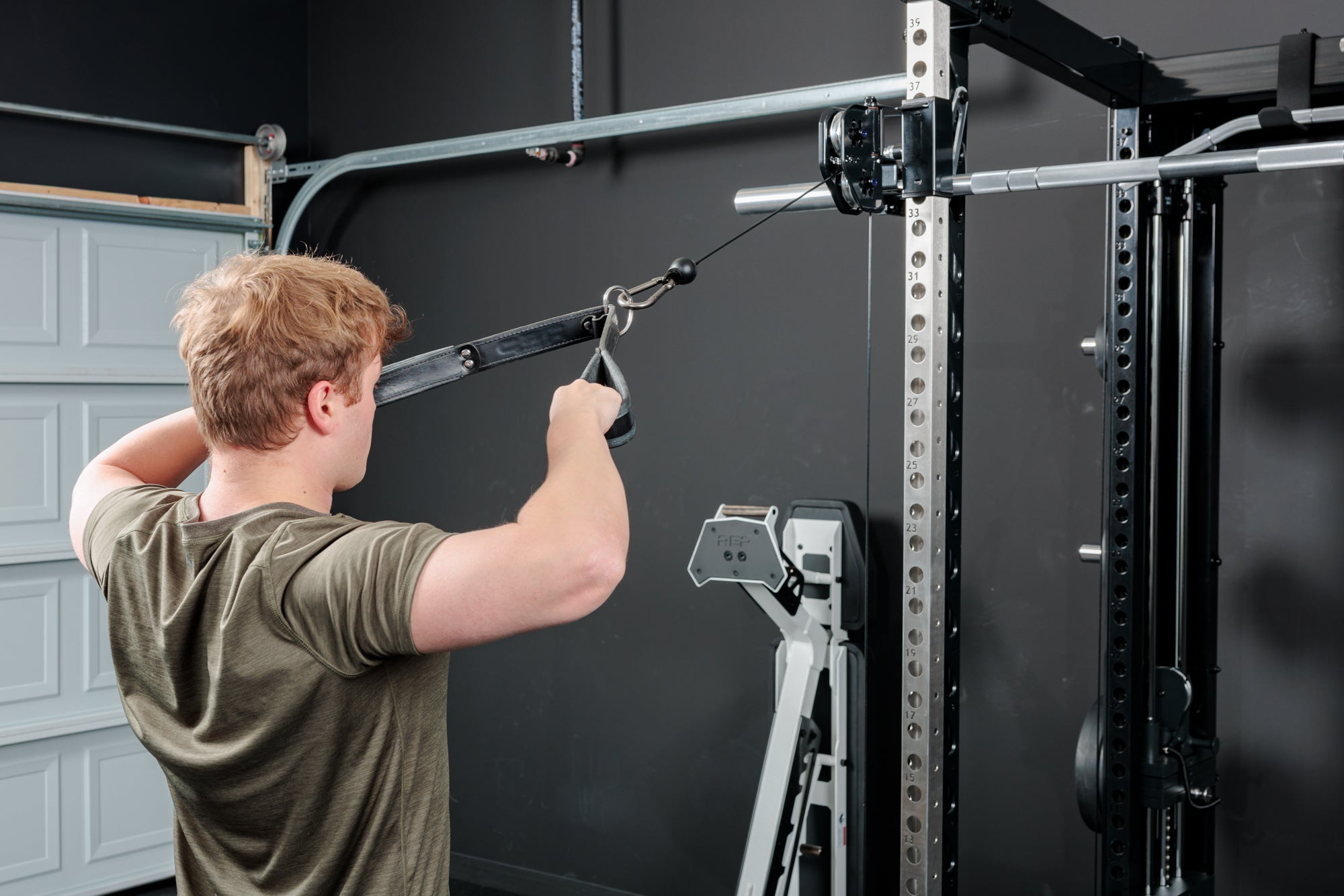 Athlete doing face-pulls on the REP Fitness Altitude™ Power Rack Cable Attachment