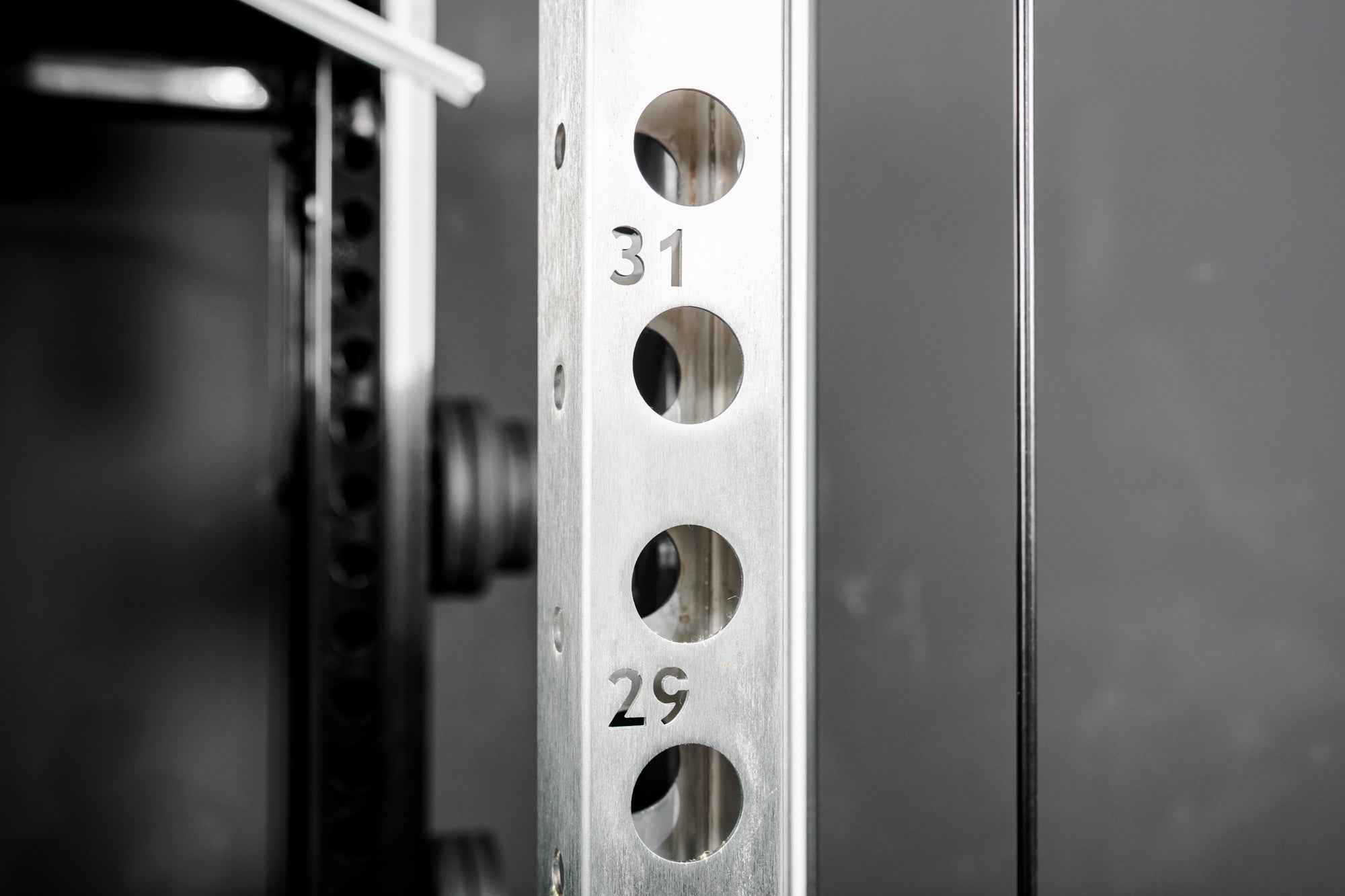 Close-up shot of the numbered rack uprights on the REP Fitness Altitude™ Power Rack