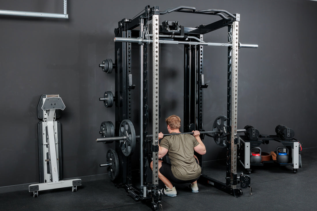 Athlete squatting inside of the REP Fitness Altitude™ Power Rack