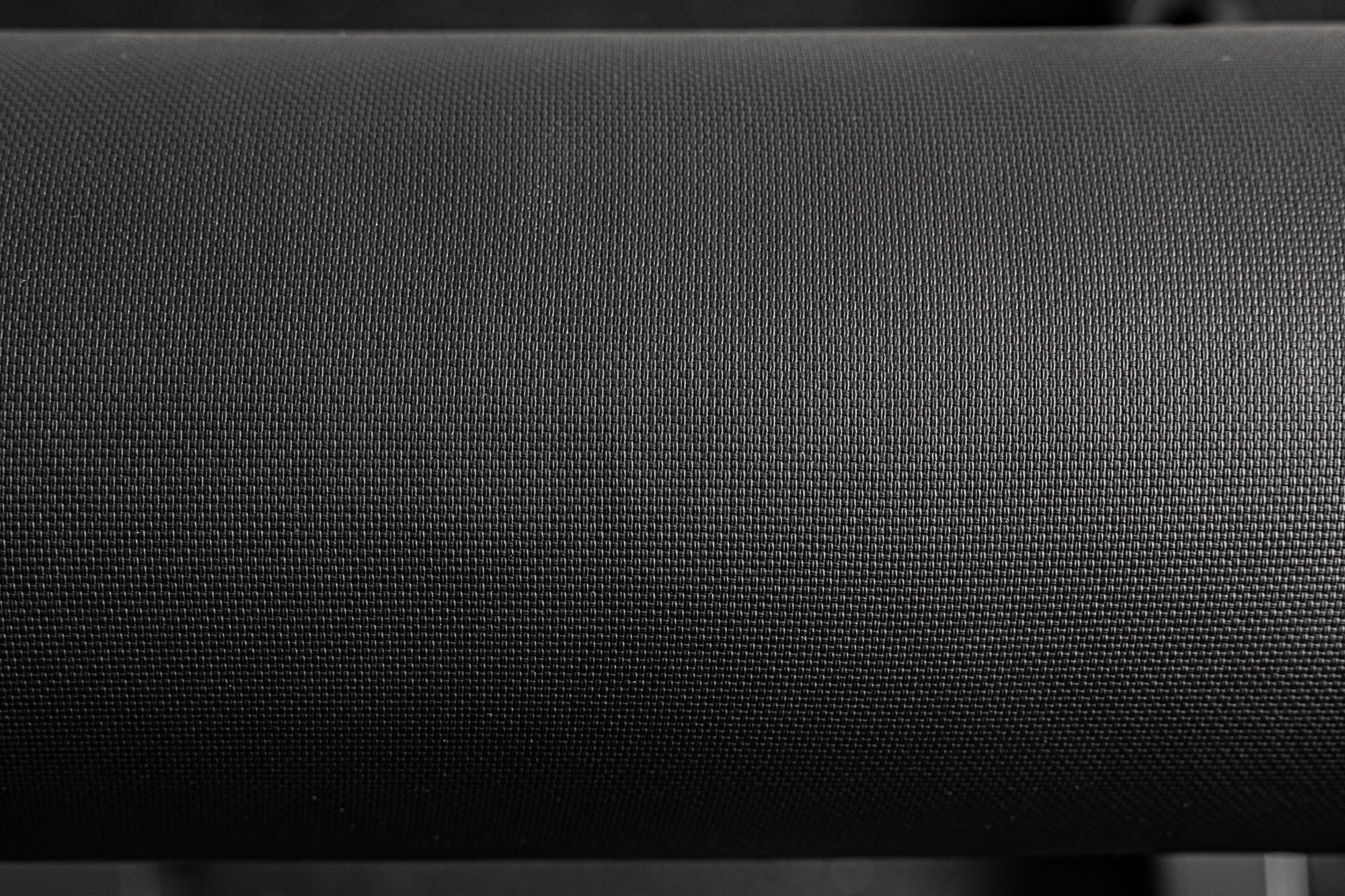 Close-up of the REP Fitness Altitude™ Leg Roller pad fabric