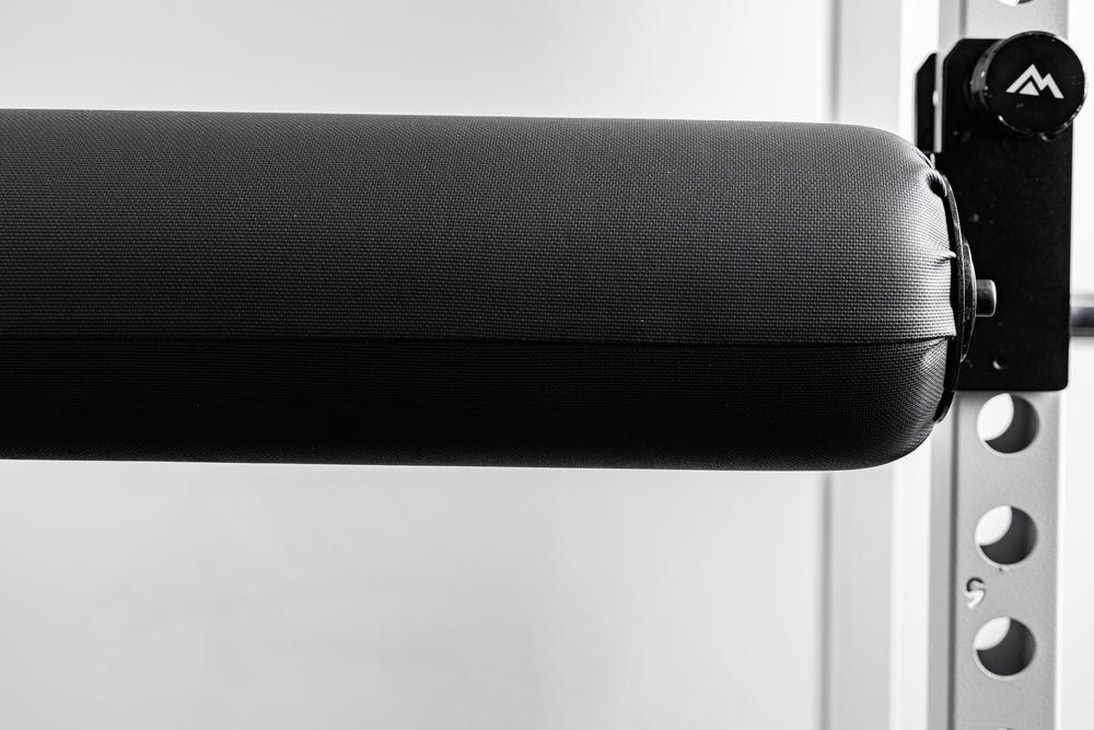 Close-up of the REP Fitness Altitude™ Leg Roller diameter compared to the mounting hardware