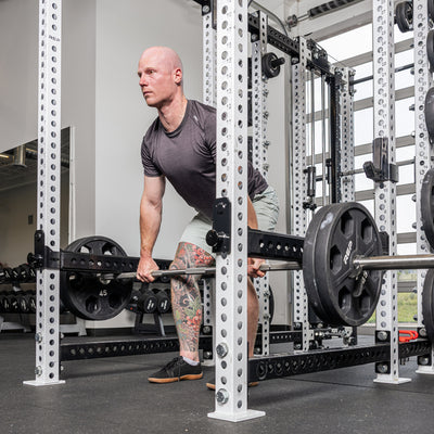 Athlete rowing with the Flip-Down Safeties 2.0 above the bar