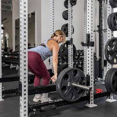 Athlete rowing with the Flip-Down Safeties 2.0 below the bar