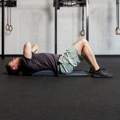 Athlete using the REP Fitness Ab Support Mat 2.0