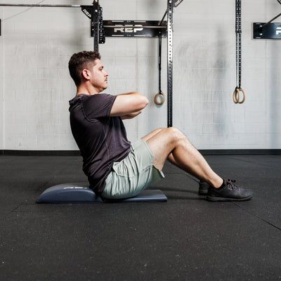 Athlete using the REP Fitness Ab Support Mat 2.0