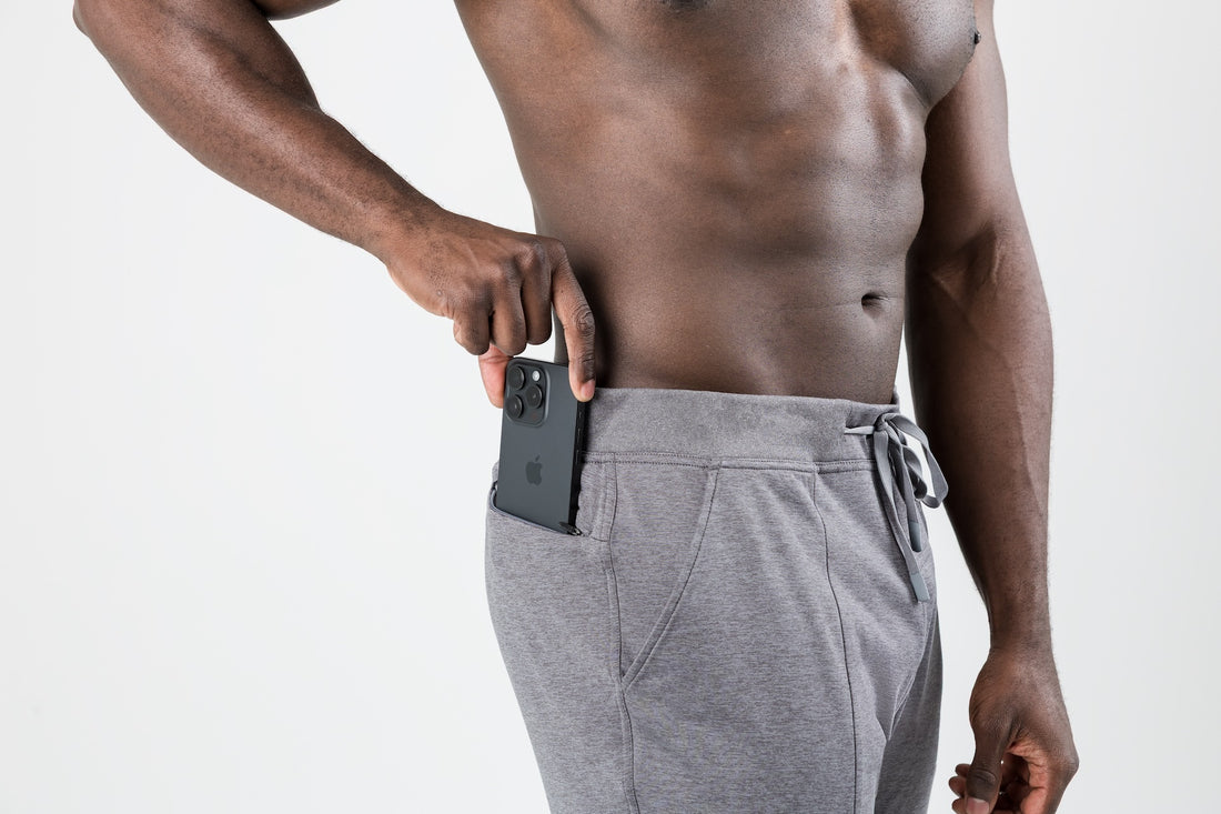 The REP Fitness Men's Apollo Joggers in Heather Cool Gray front, phone in pocket