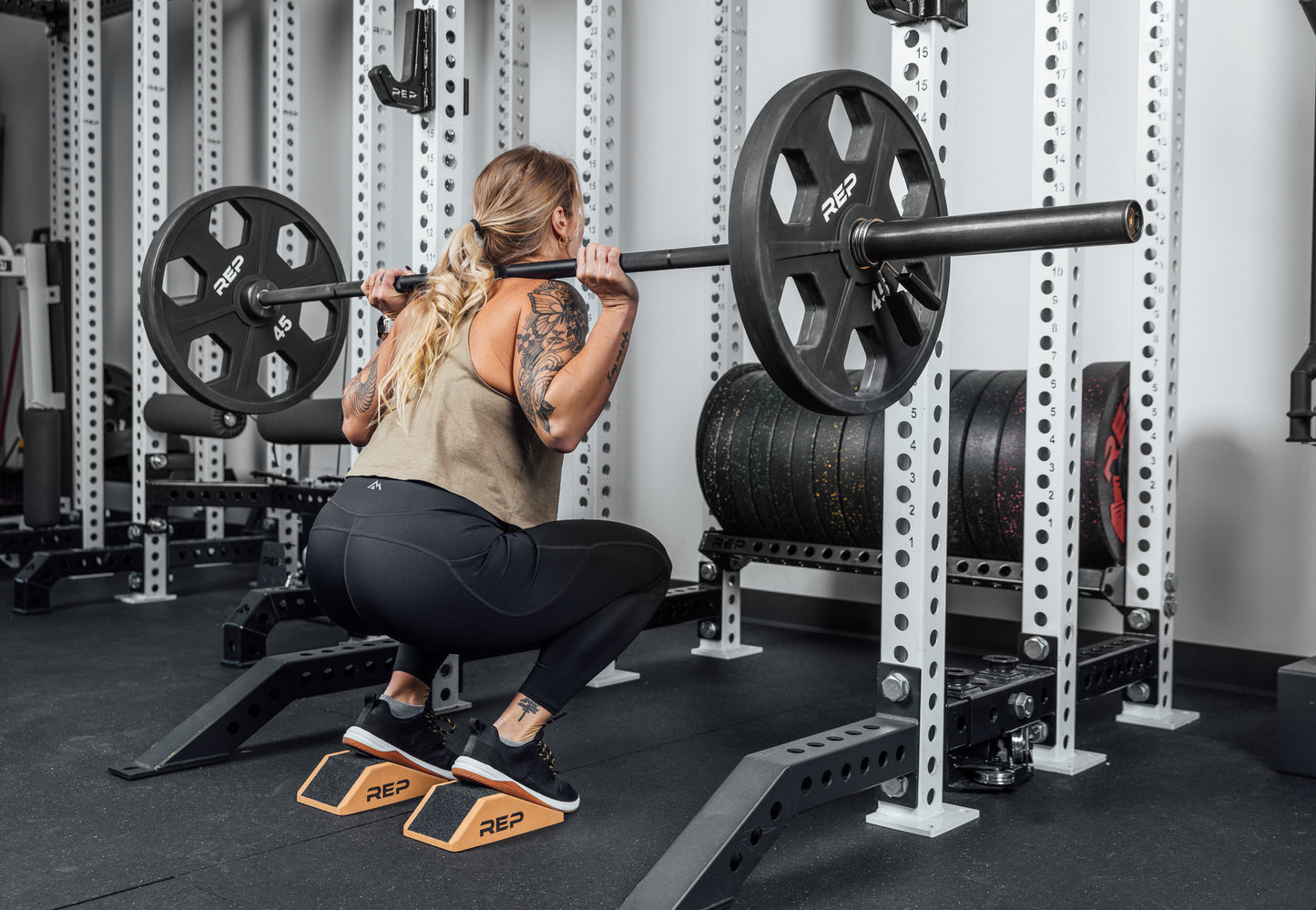 Athlete squatting using Cork Squat Wedges