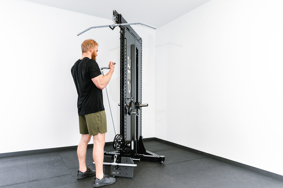 Adonis™ Cable Tower Being Used for Bicep Curls With Multi-Grip Curl Bar