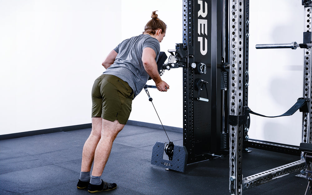 Man doing low rows using the Pegasus Attachment on the Adonis