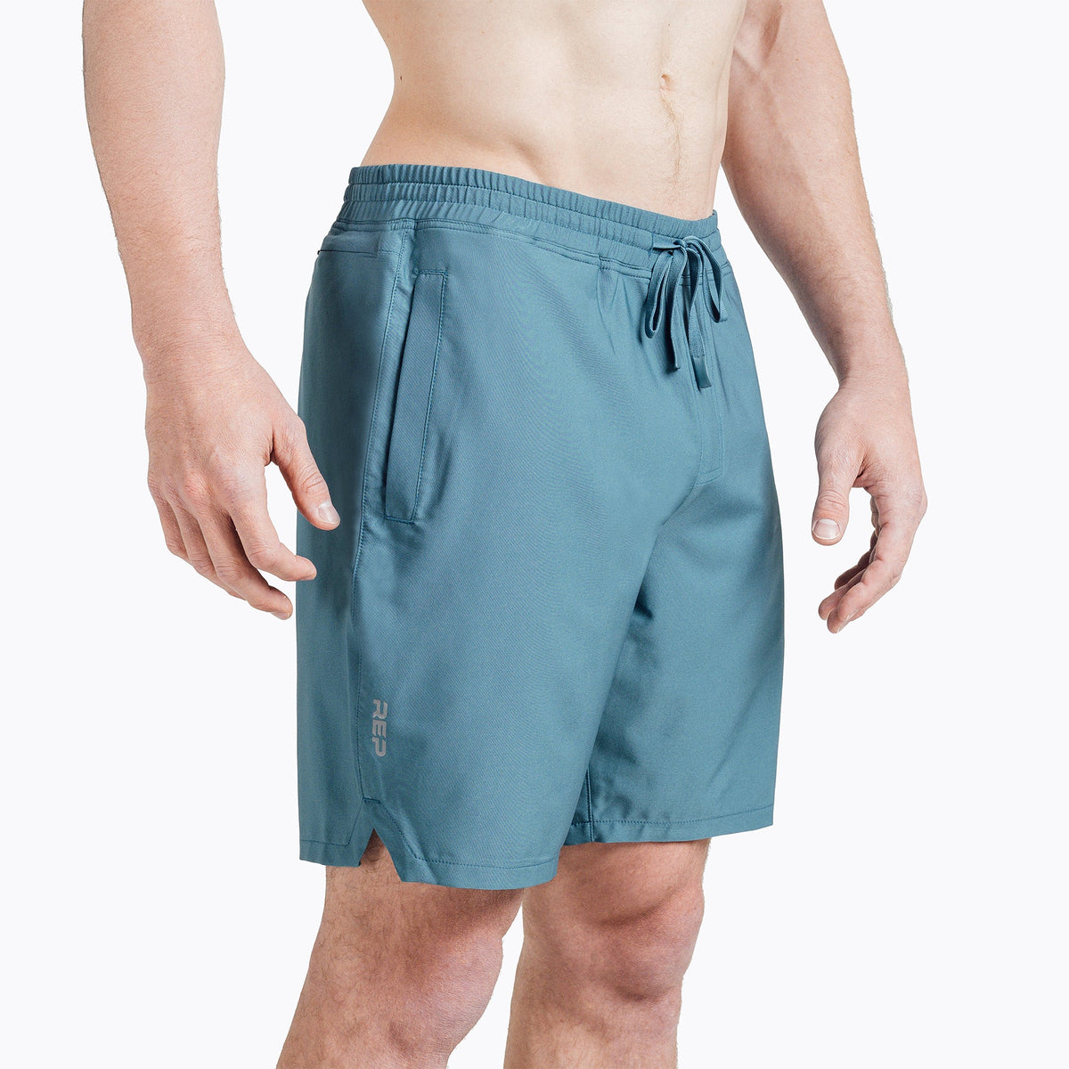 The REP Fitness Men's Motus Shorts in Slate front, studio flat lay