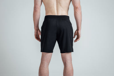 Rear shot of REP’s Men’s Apollo Shorts with a 9 inch inseam in Heather Black/Cool Gray on an athlete