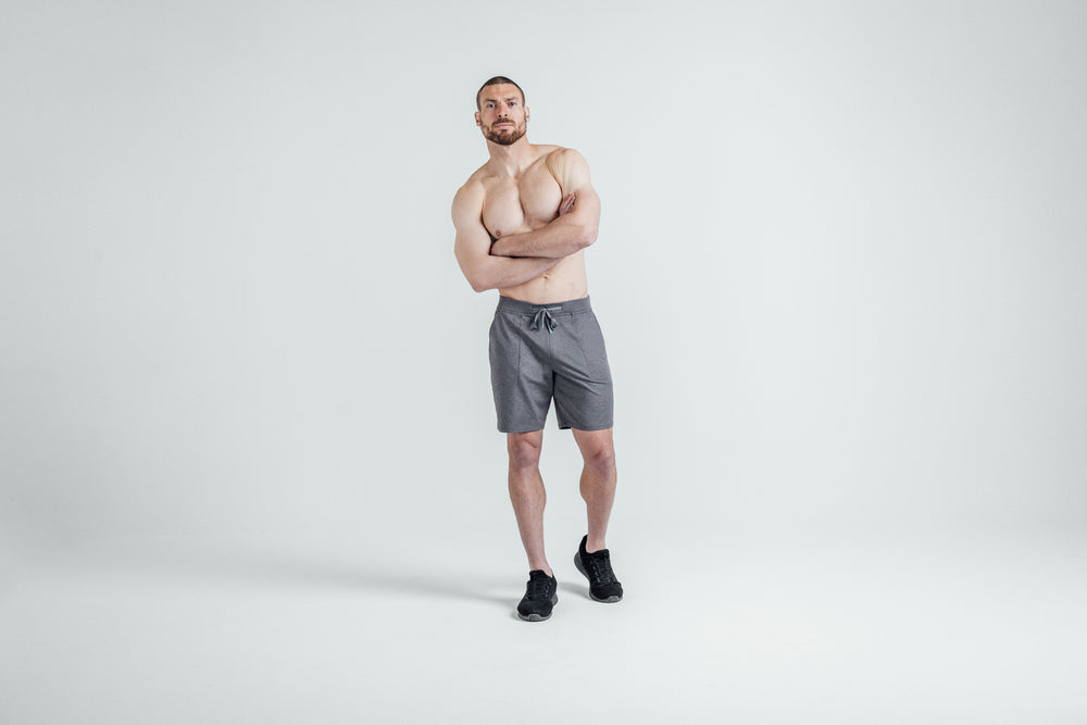 Athlete wearing REP’s Men’s Apollo Shorts with a 9 inch inseam in Heather Black/Cool Gray