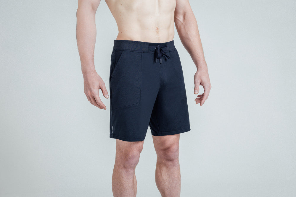 A close-up of REP Men’s Apollo Shorts with a 9 inch inseam in Heather Navy/Cool Gray on an athlete