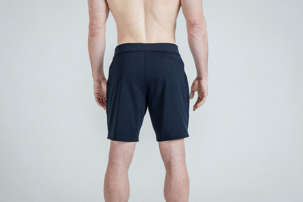 Athlete wearing REP Men’s Apollo Shorts with a 9 inch inseam in Heather Navy/Cool Gray