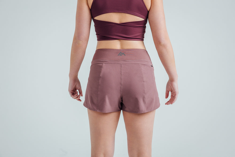 Back shot: Athlete wearing the Mauve Women’s Artemis Shorts on a white background