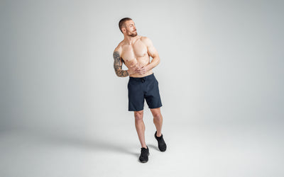 A full-body front view shot of the front of REP’s Men’s Pinnacle Shorts in Navy with a 9 inch inseam.