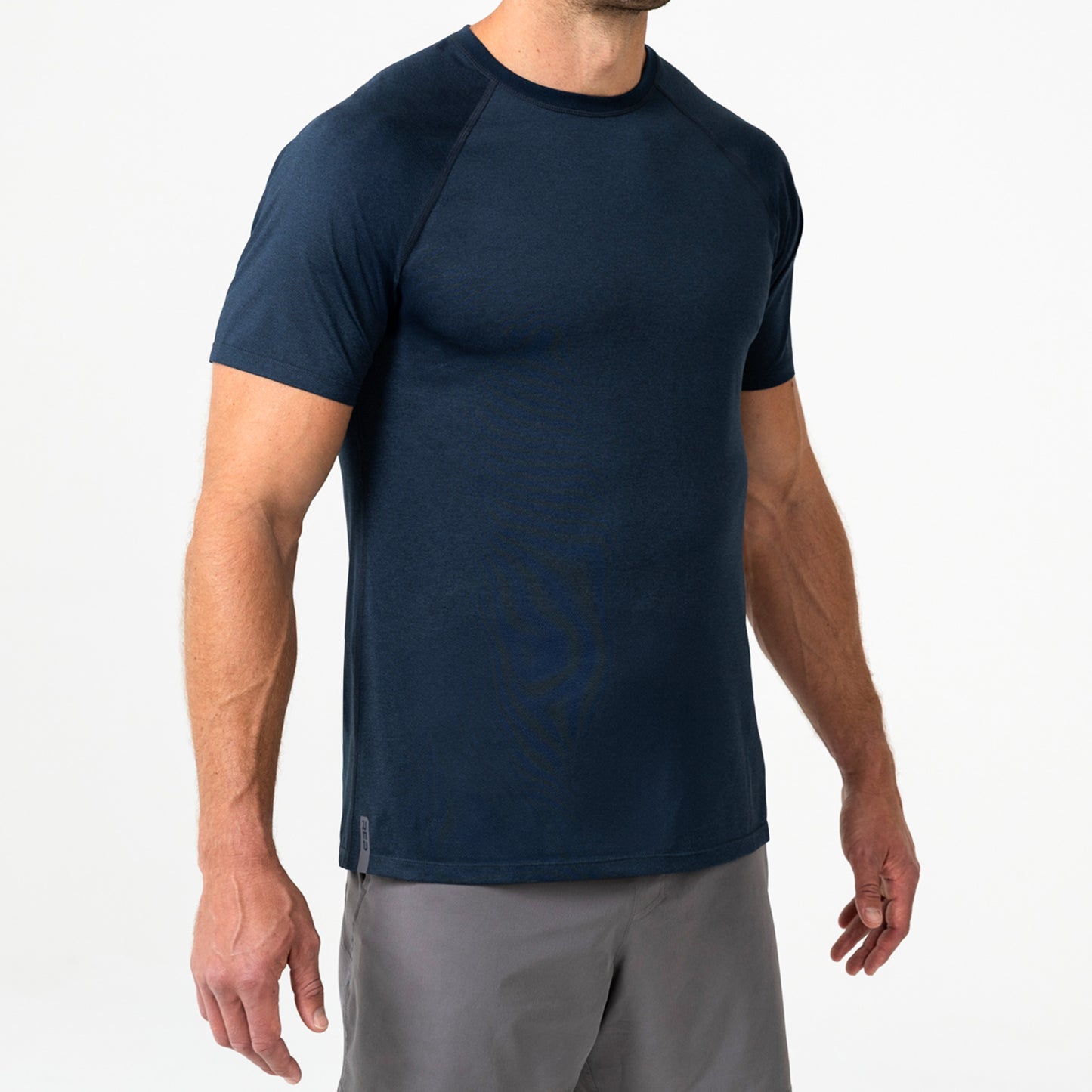 Person wearing a navy Men's Aerix athletic shirt and shorts on a white background