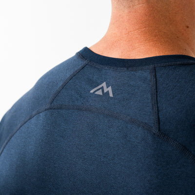 Men's Aerix navy athletic shirt with a logo on the back against a neutral background
