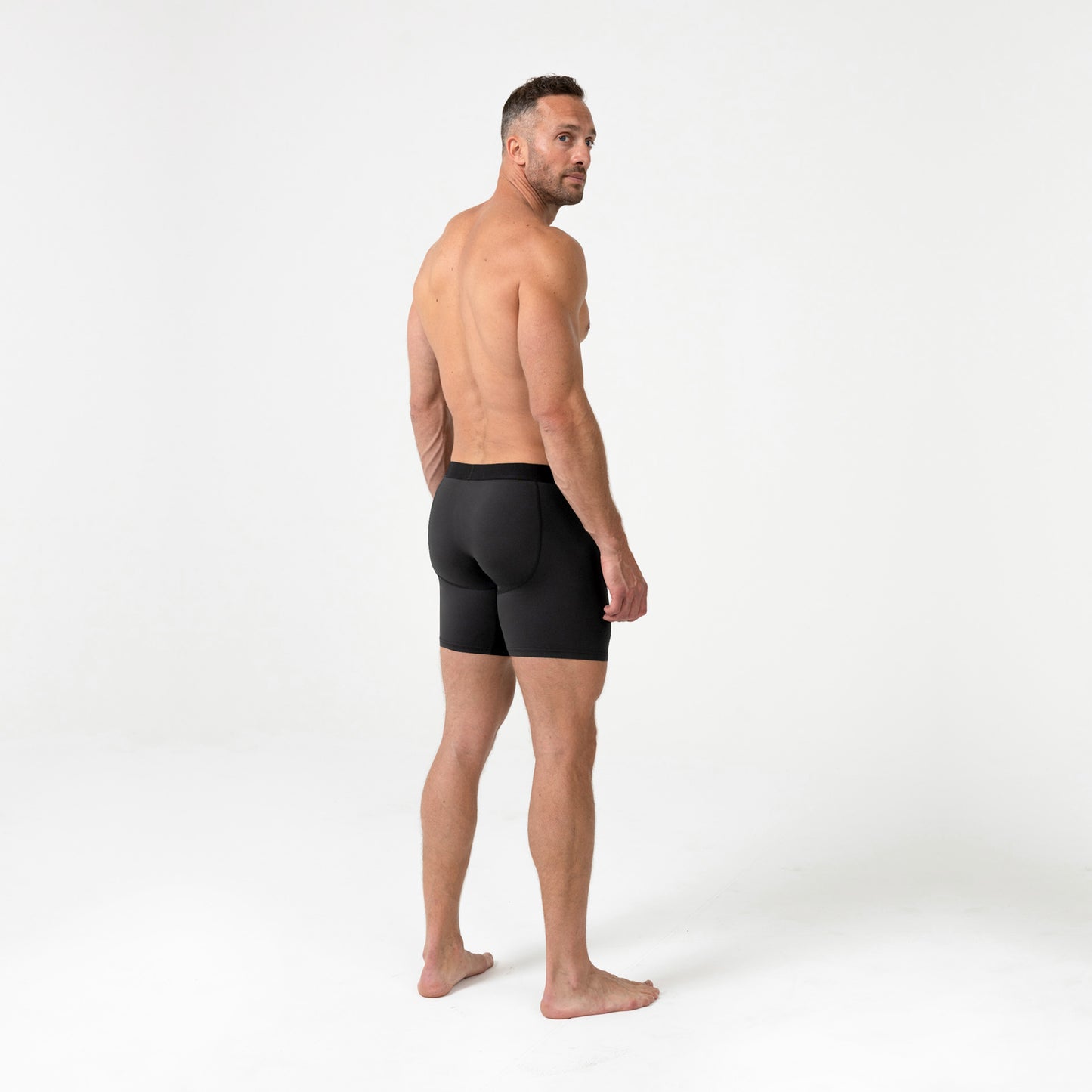 Full-body back photo of an athlete wearing REP Fitness Men's Foris Boxer Brief in Black