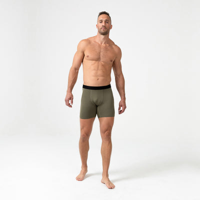 Full-body front photo of an athlete wearing REP Fitness Men's Foris Boxer Brief in Olive